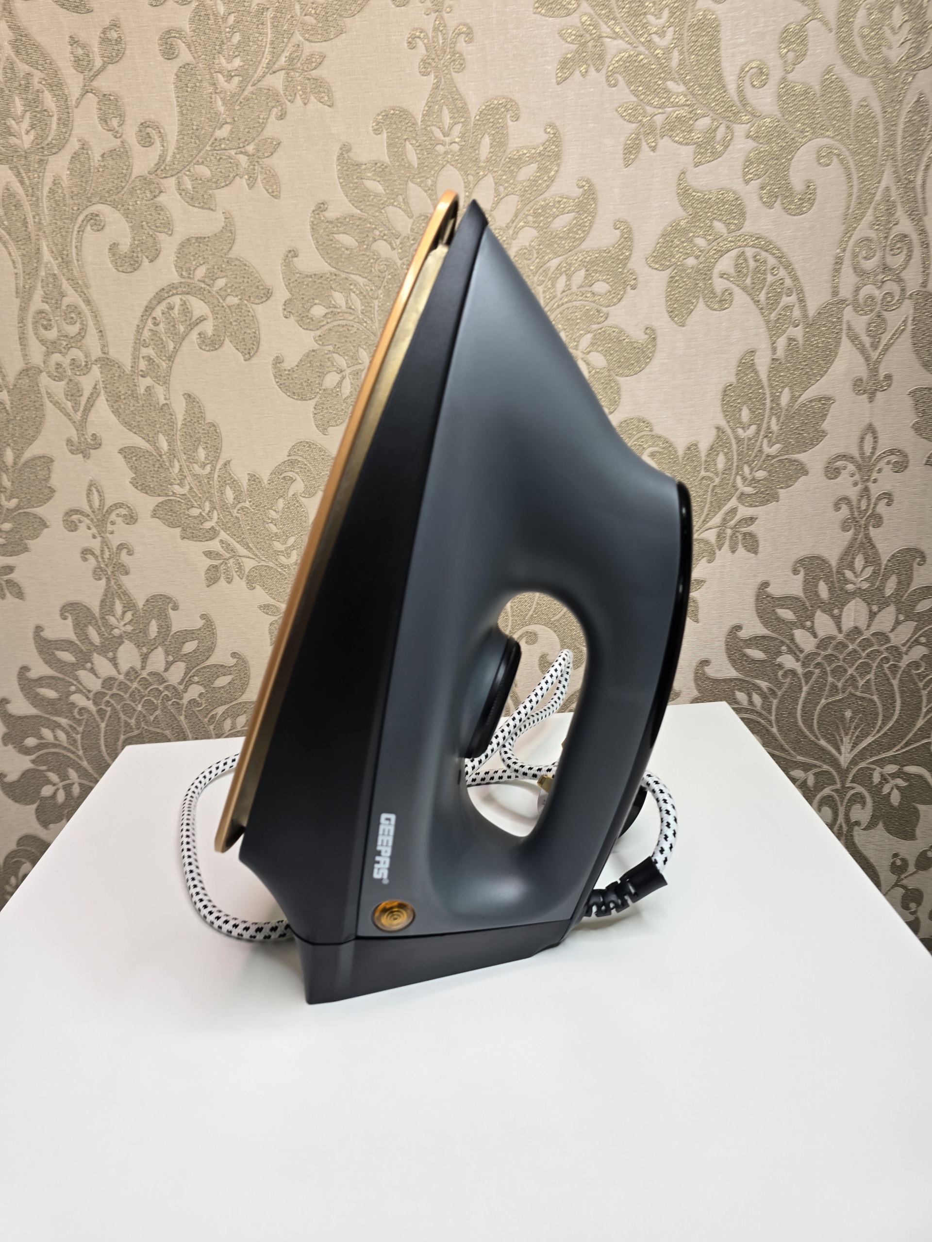 Premium Geepas 1200W Heavyweight Dry Iron – Powerful Black & Gold Non-Stick Clothes Iron