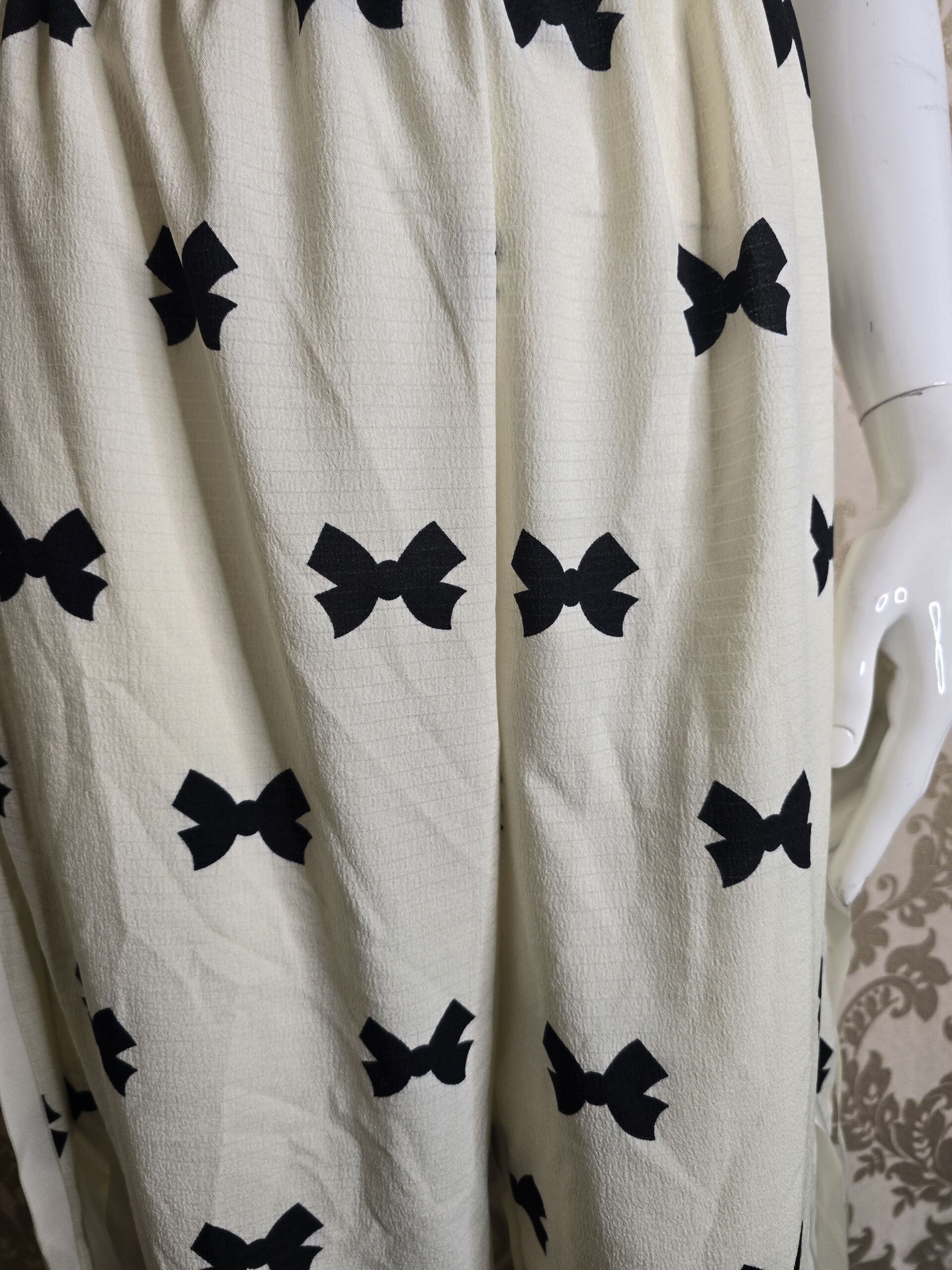 Stylish Women’s Cream Bow Print Trousers – Size Small - Image 3