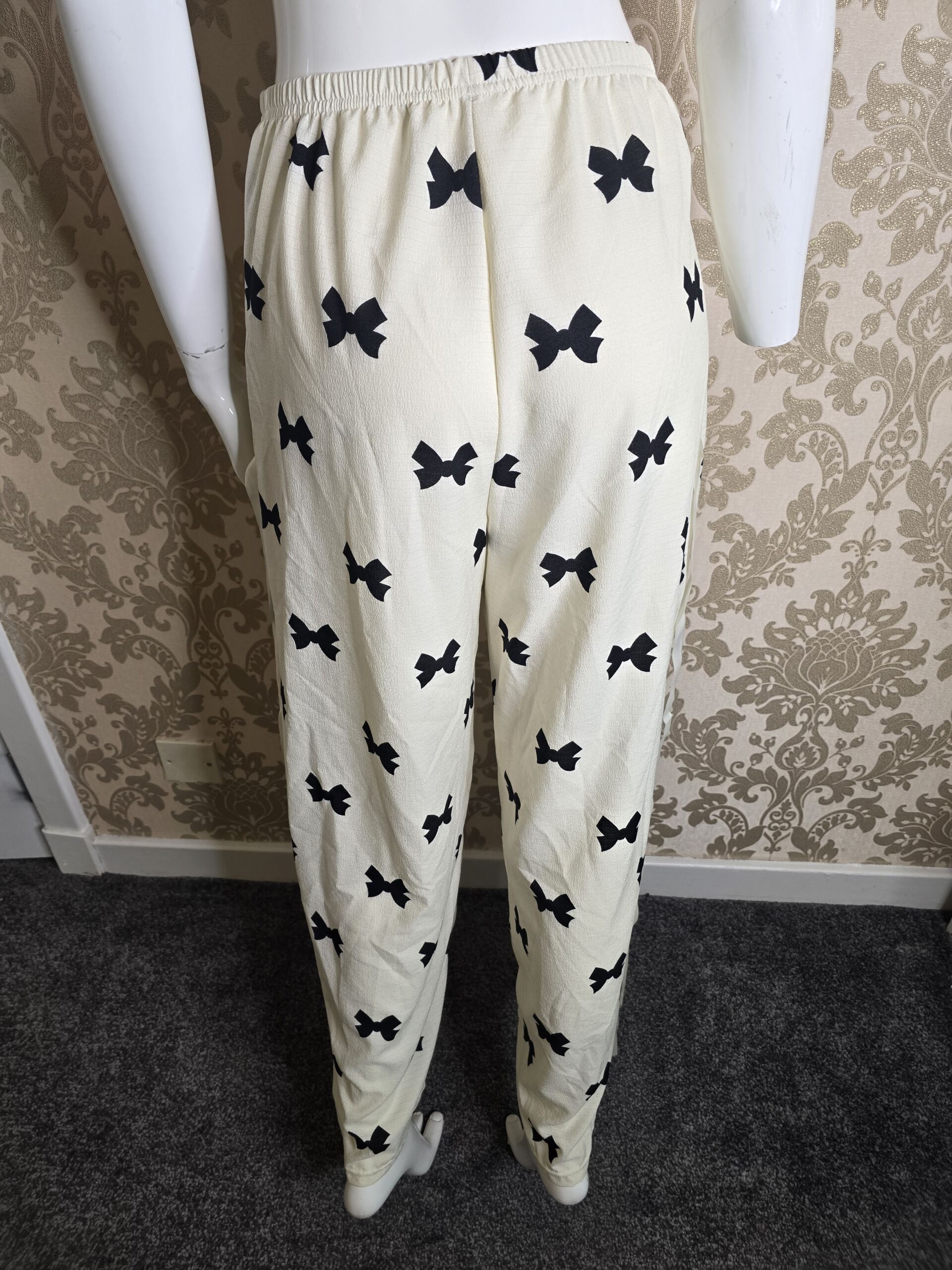 Stylish Women’s Cream Bow Print Trousers – Size Small - Image 2