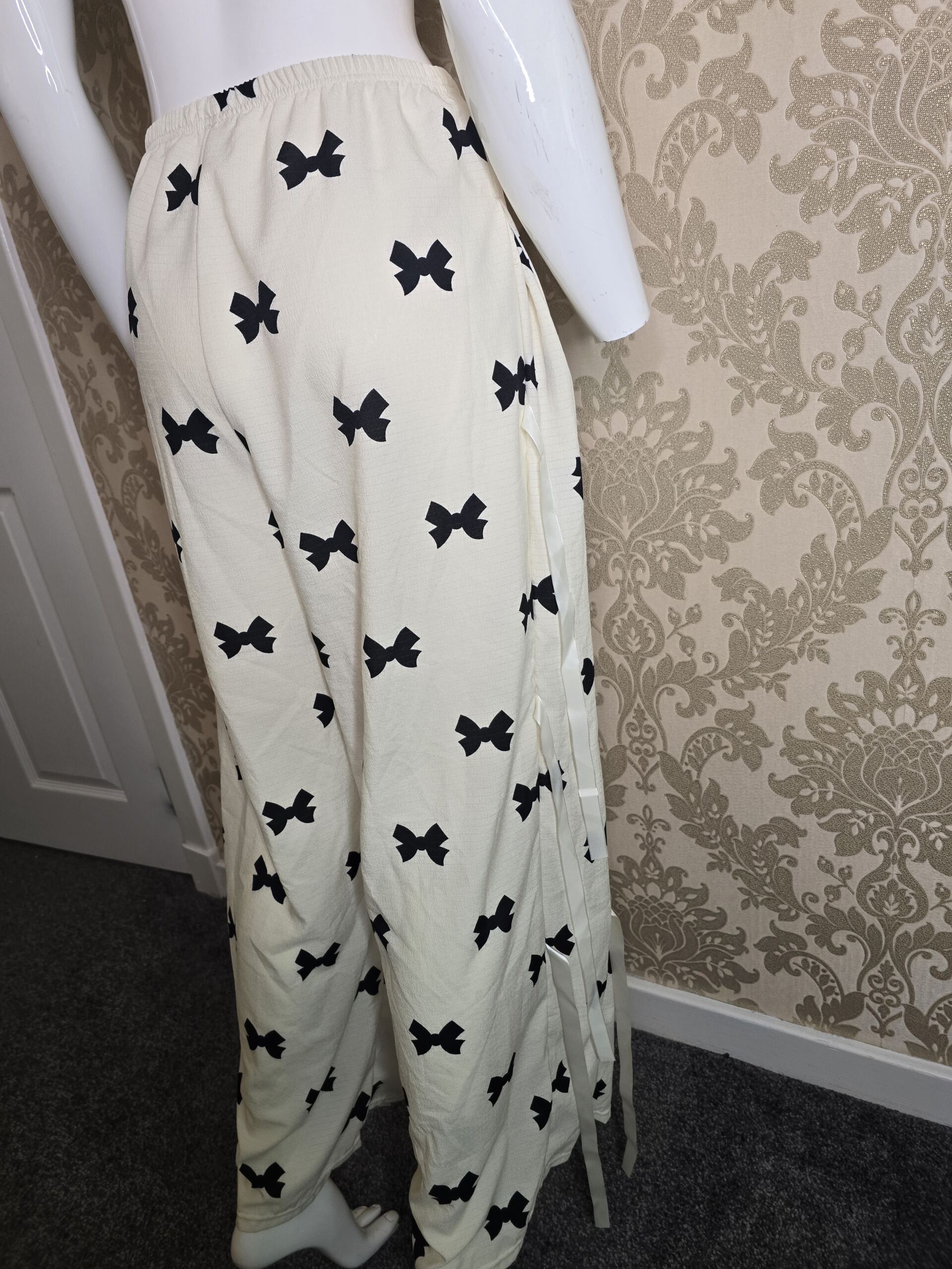 Stylish Women’s Cream Bow Print Trousers – Size Small - Image 5